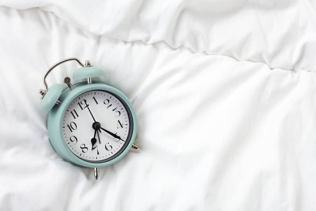 Alarm clock in the bed