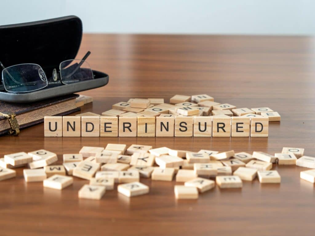 Image of letter blocks spelling our underinsurance