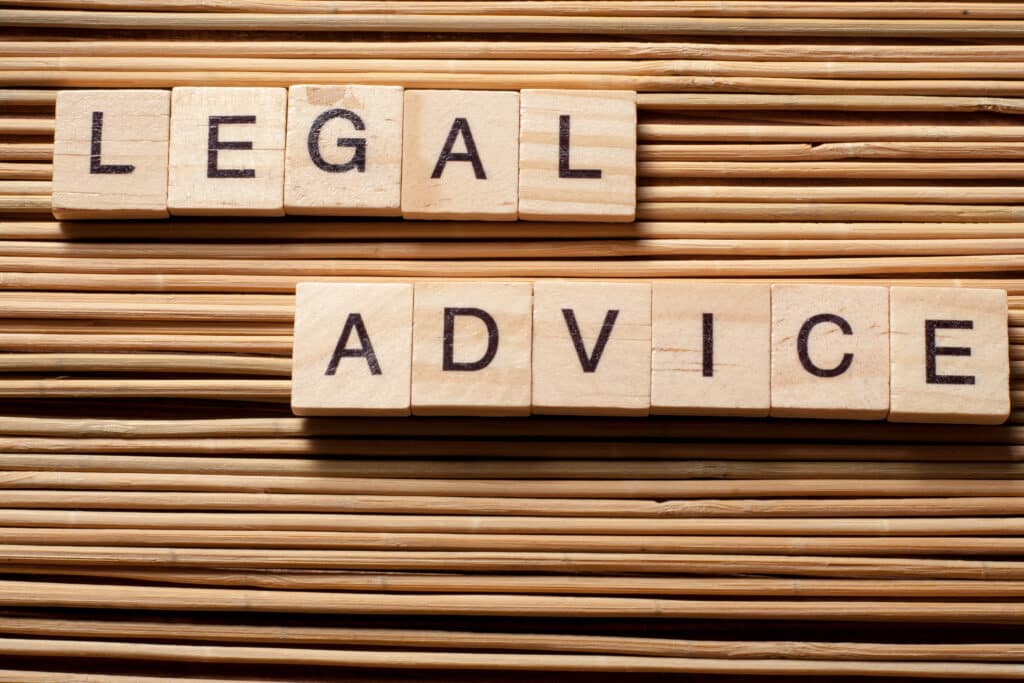 Legal Advice word written on wood block. Wooden ABC.