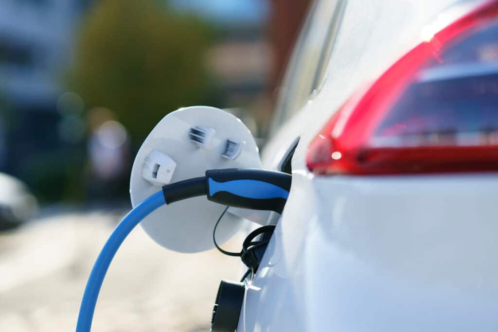Electric Vehicle is Charging on Parking Lot